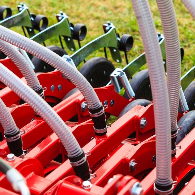 Agriculture equipment concept. Industrial detailed pneumatic, hydraulic machinery made of steel closeup